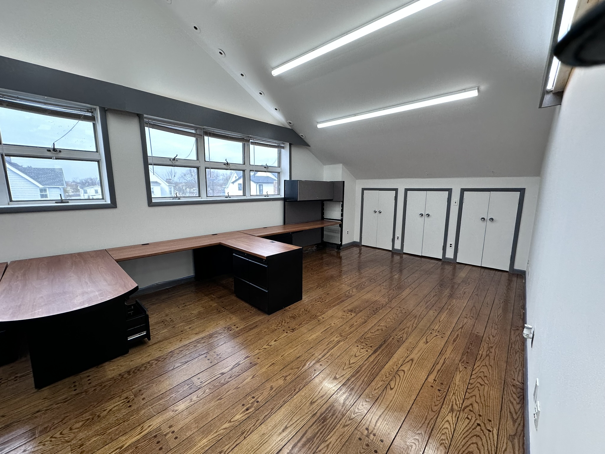 Suite 201 office with desks and windows