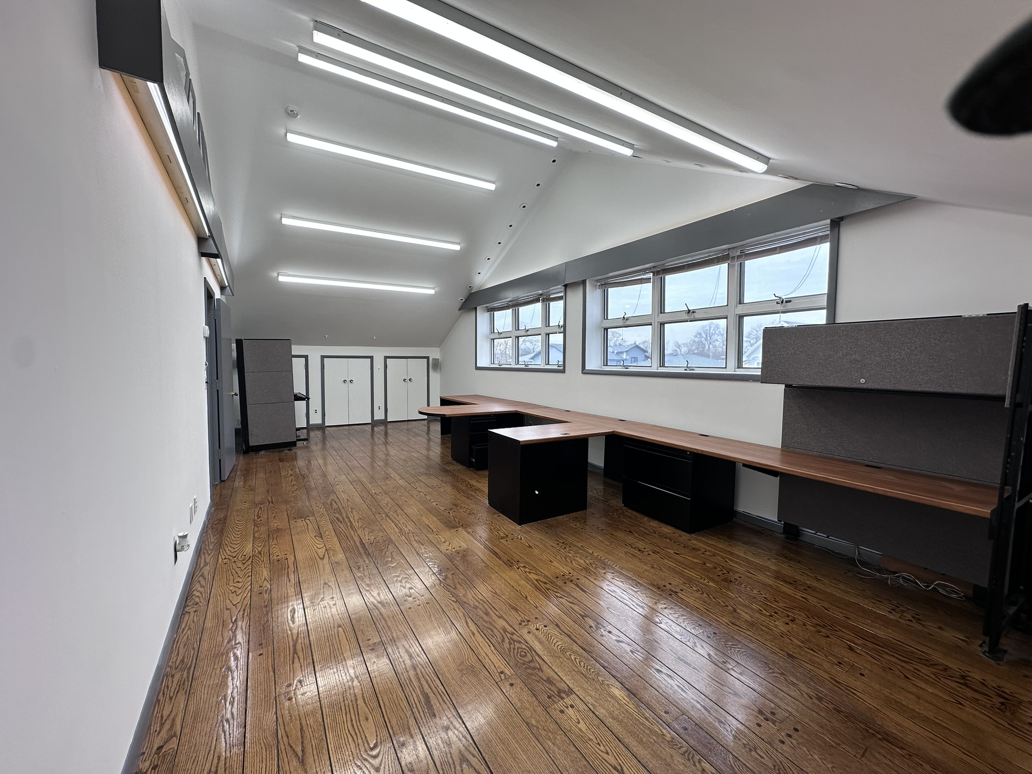 Suite 201 long office area with desk stations