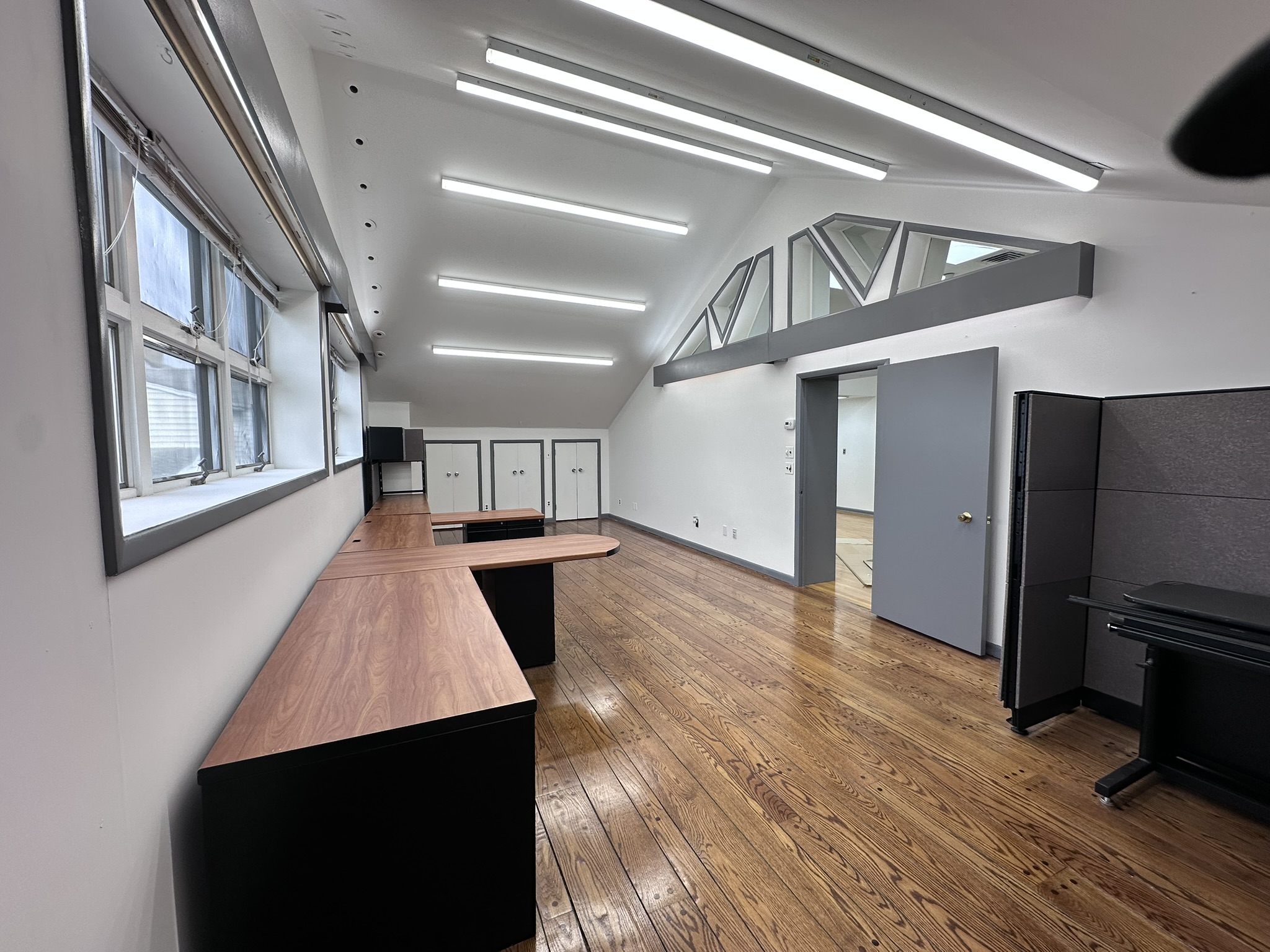 Suite 201 office with windows and workstations