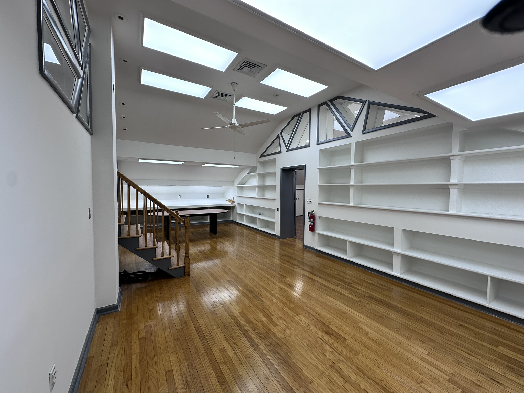 Suite 201 open office with built-in shelves