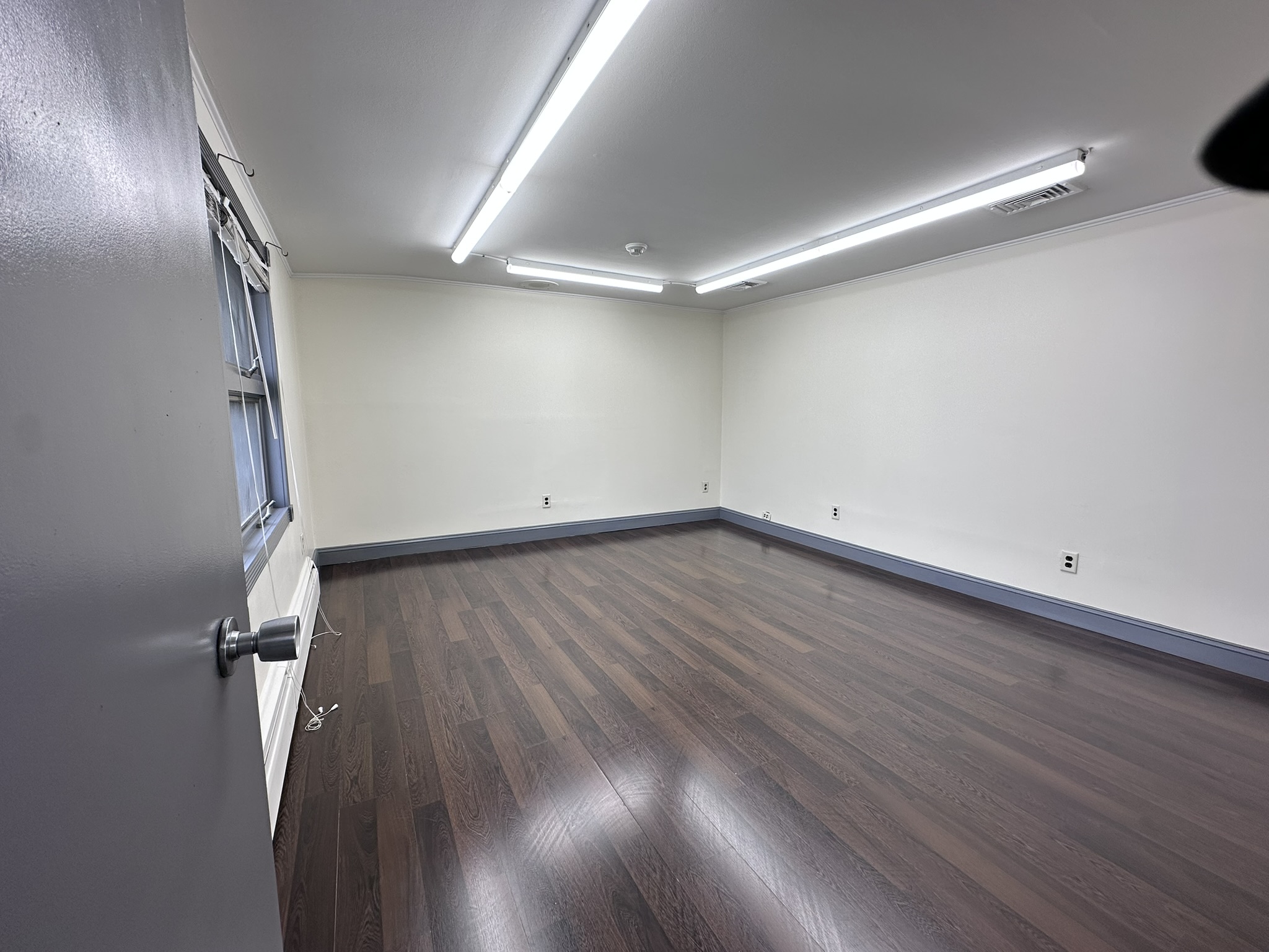 Suite 202 private office with dark flooring